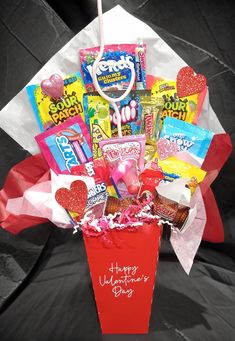 a valentine's day gift basket with candy and candies