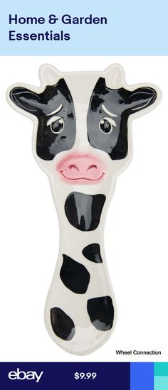 a black and white cow is shown with the words home & garden essentials on it