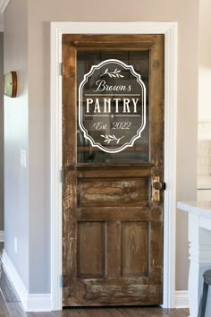 a wooden door with a sign that says johnson's pantry on the front and side