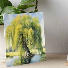 a painting of a weeping willow tree by the water's edge art board print