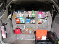 the back end of a car with its trunk open and various items in it's compartment