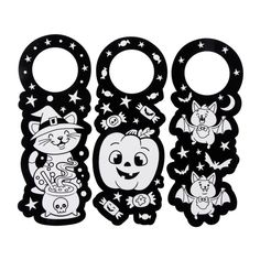 three black and white halloween door hangers with cats, bats, and witches on them