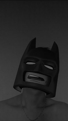 a man wearing a batman mask with his face partially covered by the back of his head