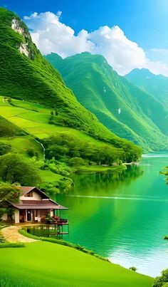 a green mountain landscape with a lake and house