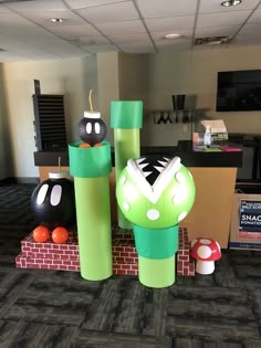 an office cubicle decorated with paper machs and mario kartman decorations on the floor