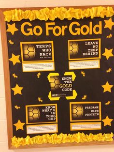 a bulletin board with gold stars on it and instructions to go for gold written below