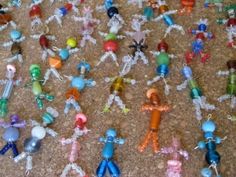 many small toy figures are on the floor