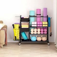 there is a rack with many different items on it in the living room, including yoga mats and dumbbells