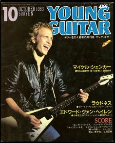 a man playing an electric guitar on the cover of a magazine