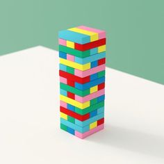 a stack of colorful blocks sitting on top of a white table