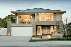 a two story house with an attached garage