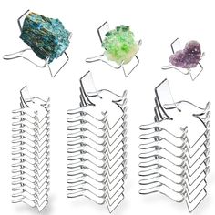 four different types of hair combs in various shapes and sizes, each with colored crystals