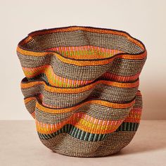 Boasting the intricate patterns, shapes and expert weaving techniques of Baba Tree's Ghanaian artisans, the Pakurigo basket features a wave-like silhouette that few weavers are able to master. Crafted from flexible yet strong palms, the Pakurigo's wide diameter allows for easy storage in your home, from extra blankets Kids Toy Shop, Heritage Crafts, Pet Scarf, Handwoven Fabric, Community Engagement, Home Scents, Cold Weather Accessories, Fabric Rug, Intricate Patterns