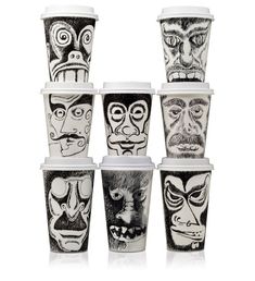 six cups with faces painted on them are stacked in a row and one is empty