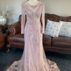 a dress on display in front of a couch