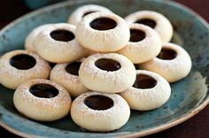 a blue plate filled with cookies on top of a table