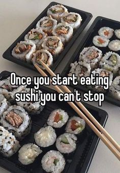 two trays filled with sushi and chopsticks next to each other