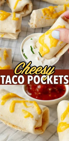 a person dipping cheese on top of taco pockets