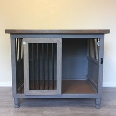 a dog kennel is shown with the door open