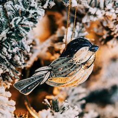 a bird ornament hanging from a tree