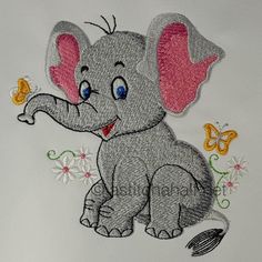 an elephant with a butterfly on it's back is embroidered onto a t - shirt