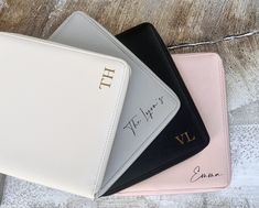 three personalized wallets sitting next to each other