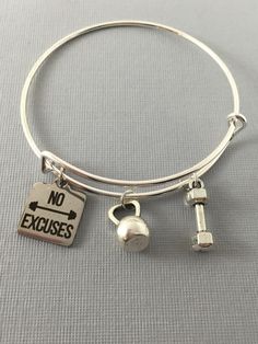 "No Excuses Workout Charm Bangle Bracelet. Features: Adjustable Bangle Bracelet Silver Plated: Zinc Alloy Metal Stainless Steel Charms with \"No Excuses\" laser engraved. Measure 61mm Your purchase will arrive in a cute gift box ready to give as a gift or special present for yourself. If you would like to add on a birthstone charm for $3.00 Additional initial charm $3.00 Go back to OurLitteCharms https://www.etsy.com/shop/ourlittlecharms" No Excuses Workout, Fitness Jewelry, Adjustable Bangle Bracelet, Cute Gift Boxes, No Excuses, Fitness Gifts, Bangle Bracelets With Charms, Adjustable Bangle, Silver Bangle Bracelets