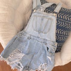 Size: 6 / Medium Color: Washed Denim Condition: Great / Never Worn Spring Distressed Overall Jeans, Ripped Denim Jumpsuit For Spring, Ripped High Rise Denim Jumpsuit For Spring, Casual Ripped Overalls For Spring, Ripped Cotton Overalls For Spring, Distressed Denim Overalls For Spring, Distressed Light Wash Overalls For Summer, Distressed Overall Jeans For Summer, Ripped Light Wash Overalls For Spring