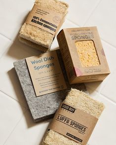 four different types of sponges sitting on the floor next to each other in boxes