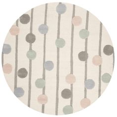 a round rug with multicolored dots on it in grey, pink and white