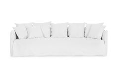 a white couch with lots of pillows on it's back and side cushions in the middle