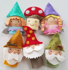 small felt gnomes are arranged in a circle