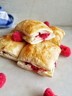 raspberry filled pastries stacked on top of each other