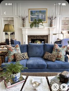 a living room filled with furniture and a fire place