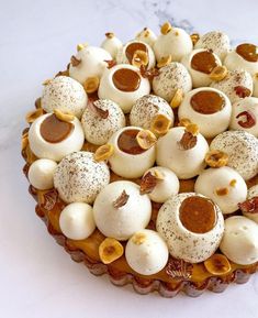 there is a cake that has been decorated with nuts and other toppings on it