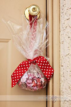 a door hanger with candy in it that says i've kissed the ground