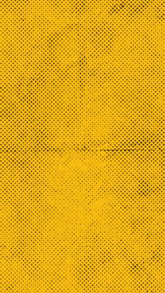 an abstract yellow background with black dots