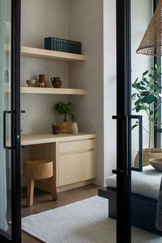 a room with shelves and plants in it