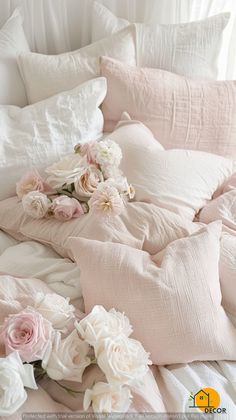 a bed with white and pink flowers on it