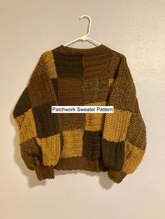 a brown and black sweater hanging on a white wall with the words patchwork sweater pattern