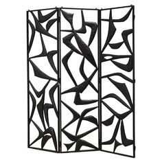 a room divider made out of metal with black paint on it's sides