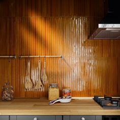 the kitchen counter is clean and ready to be used as cooking utensil holders