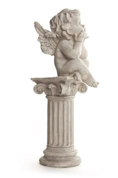 an angel statue sitting on top of a pedestal