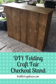 the diy folding craft fair checkout stand is made from an old wooden box