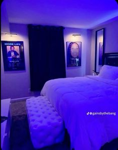 a bedroom with purple lighting and pictures on the wall above the bed, along with a footstool