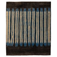 a rug with blue and beige stripes on it