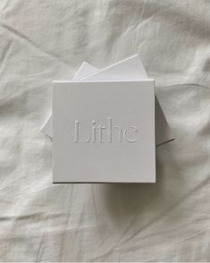 three white cards with the word little on them