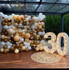 a large balloon wall with the number 30 on it