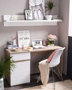 a white chair sitting next to a wooden desk