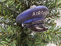 an air force ornament hanging from a christmas tree